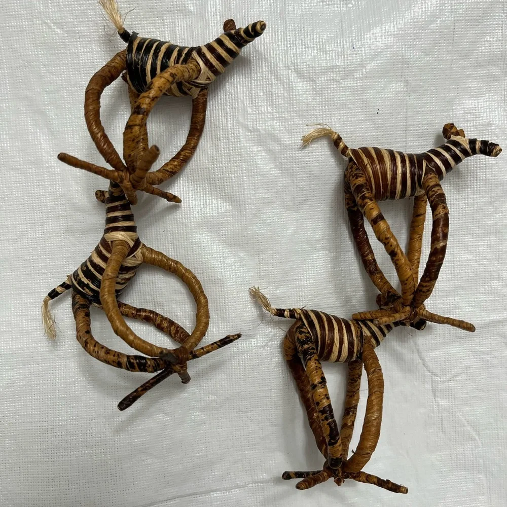 Four hand woven napkin holders